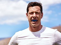 Man wears mouthguard