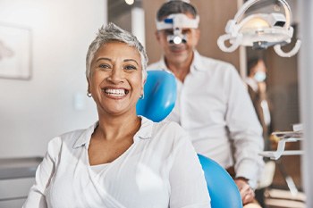 Woman in dental chair smiling