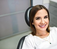 Woman smiling while relaxing in treatment chair